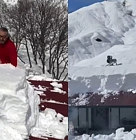 Yoğun yağış nedeniyle evler kara gömüldü,karlar kütleler halinde atıldı