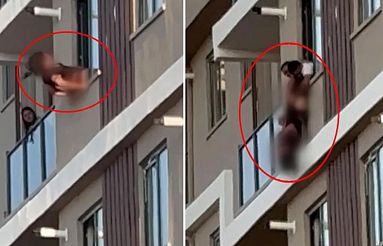 Camdan sarktı: Baş aşağı asılı kaldı