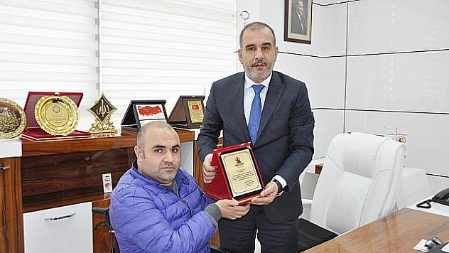 MİDDER'DEN BAŞKAN ALAN'A PLAKET 