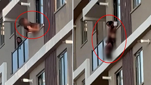 Camdan sarktı: Baş aşağı asılı kaldı