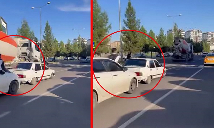 Diyarbakır'da yolda kalan aracı kaput üzerinden ittirdiler